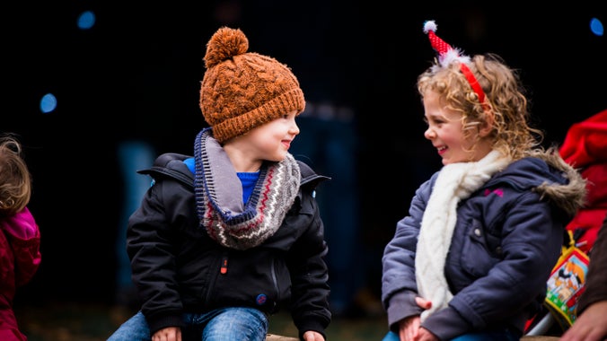 Children wrapped up warm in hats, scarves and winter coats enjoy a festive day out during Christmas celebrations at Felbrigg.
